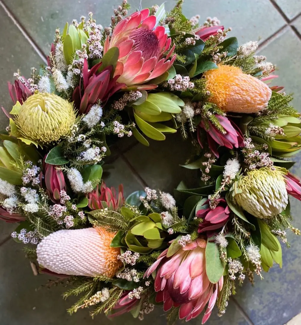 Native sympathy wreath of proteas, banksia and waxflower