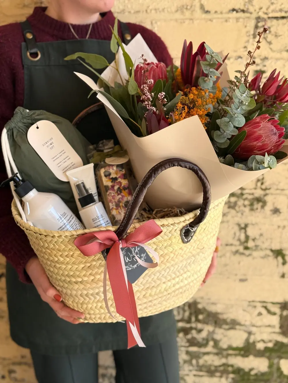 Woven gift basket with native flowers and pamper products